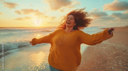 Energetic young woman with open arms enjoys the warmth of the sun on a beautiful beach, feeling the joy of life..