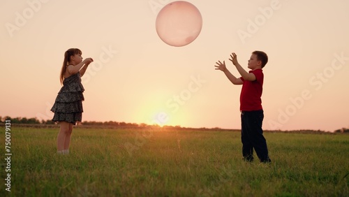 Girl Child Boy Kid playing big ball sunset, children dream flying, happy family, team, teamwork pure bliss occurs hearts connect, friendship blossoms game children's dreams, hope heart, childhood