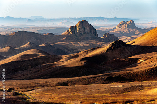 Hoggar landscape in the Sahara desert  Algeria. A view from Assekrem of the mountains and basalt organs that rise up in the morning light.