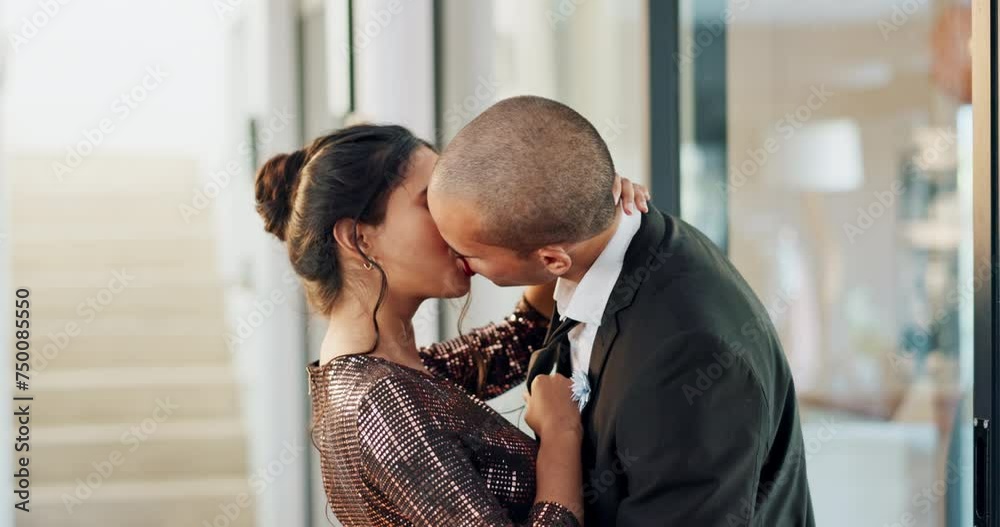 Couple, love and kiss with passion on a date for formal event, intimacy and romance on valentines day at home. Lovers, woman and man in luxury house, suit and dress for anniversary or relationship