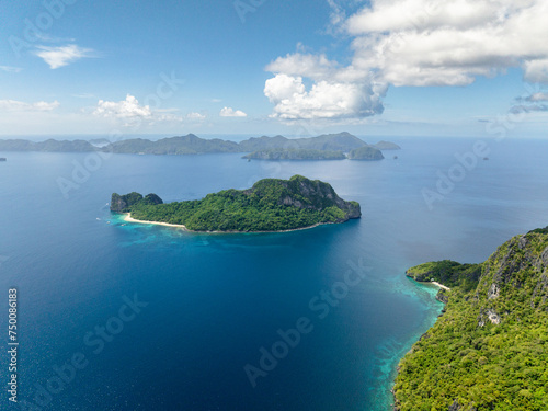 Helicopter Island surrounded by blue sea. Blue sky and clouds. El Nido, Palawan. Philippines. © MARYGRACE