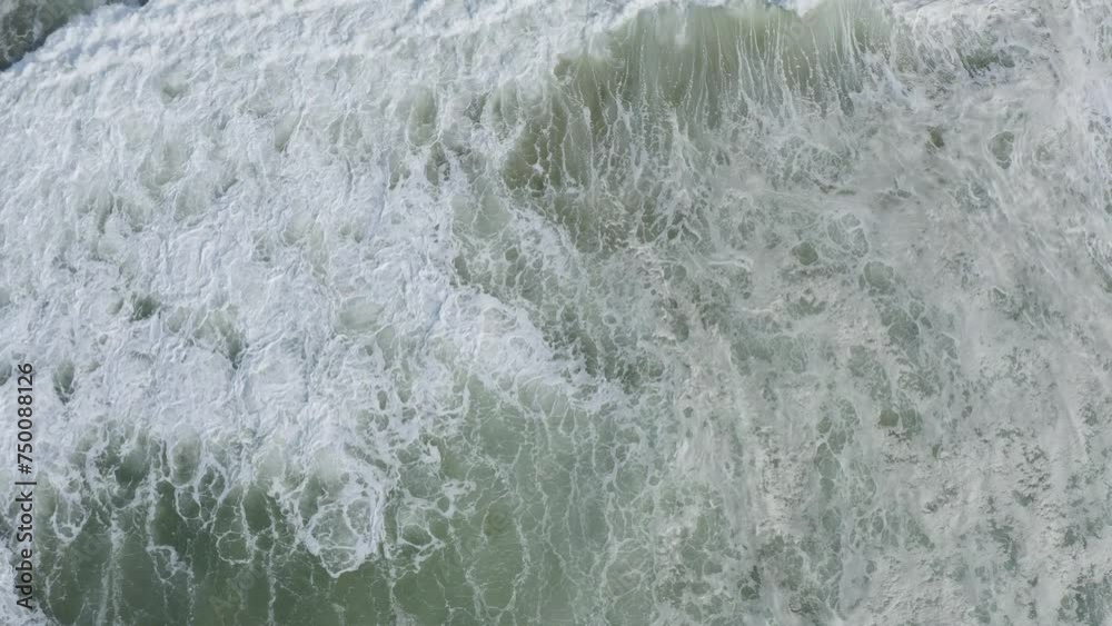 Aerial view of waves crashing on the shore at Atlantic Ocean. Empty line-up for surfers. Cinematic shot, 4k. Log recording for better color correction option. Aerial view of waves crashing on the shore at Atlantic Ocean. Empty line-up for surfers. Cinematic shot, 4k. Log recording for better color correction option.