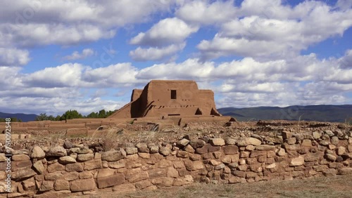 Pecos National Historic Park in New Mexico. Pecos Pueblo Mission Church Mission Nuestra Señora de los Ángeles de Porciúncula de los Pecos, a Spanish mission near the pueblo. Fast moving clouds. photo