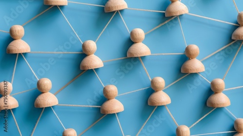 Social media networking. Network with members connected with each other. Group of people. Communication, teamwork, community, society. Abstract concept with wooden pieces on blue background. 
