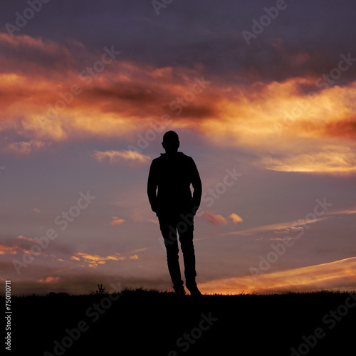 man silhouette in the countryside and sunset background