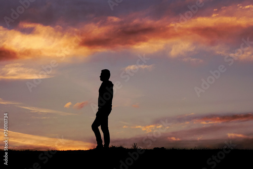 Fototapeta Naklejka Na Ścianę i Meble -  man silhouette in the countryside and sunset background