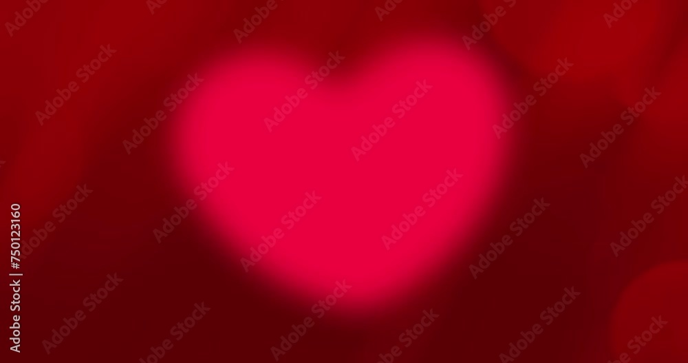 Glowing red heart animation on red background for Valentine's day and wedding concept Glowing red heart animation on red background for Valentine's day and wedding concept