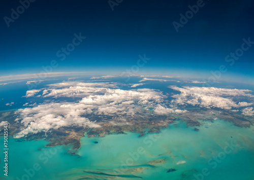 An aerial view of the Turks and Caicos Islands from an airplane window