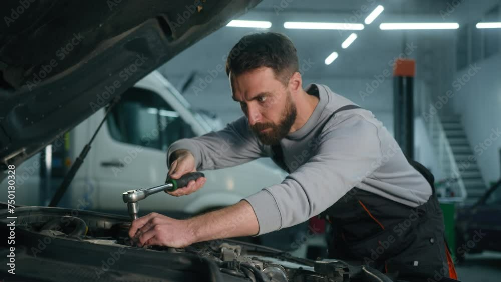 Professional auto mechanic engineer Caucasian man working in vehicle service engine specialist fixing motor automobile using spanner key wrench tool repair car broken truck in garage workshop station
