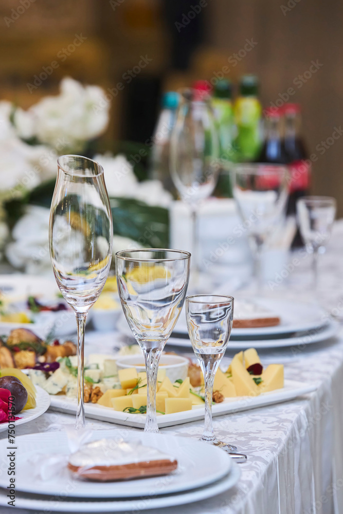 Crystal glasses on the festive table. Serving in the restaurant