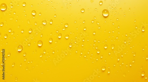 Vibrant water droplets embellish a yellow background.