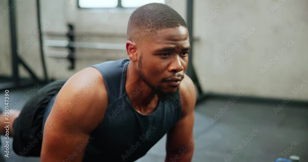 Black man, fitness and push ups in workout, exercise or endurance on floor for strength at gym. African male person, bodybuilder or athlete lifting body weight for chest or muscle gain at health club Black man, fitness and push ups in workout, exercise or endurance on floor for strength at gym. African male person, bodybuilder or athlete lifting body weight for chest or muscle gain at health club