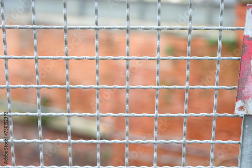 Photos grid for protection as a barrier of a confinement field