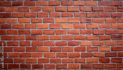 Close up view of a red brick wall. Texture of old dark brown and red brick wall panoramic background. Minimal pattern background concept. Trendy brick wall background idea. Copy space.