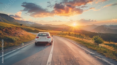 Car moves on a mountain road on a summer sunny day