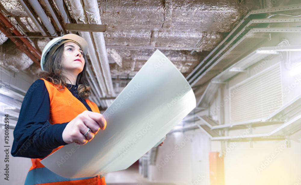 Woman engineer is standing in basement. Technologist inspects ventilation pipes. Girl in engineering corridor. Engineer holds construction documents. Woman in construction helmet and vest. Woman engineer is standing in basement. Technologist inspects ventilation pipes. Girl in engineering corridor. Engineer holds construction documents. Woman in construction helmet and vest.
