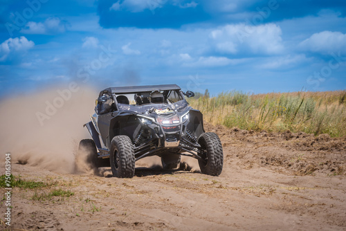 UTV in action offroad vehicle racing on sand dune. Extreme, adrenalin. 4x4. © Anton Tolmachov