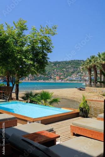 View of the beach and sea with umbrellas and sun loungers  summer sunny day