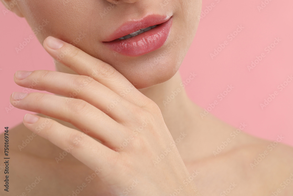 Young woman with beautiful full lips on pink background, closeup Young woman with beautiful full lips on pink background, closeup