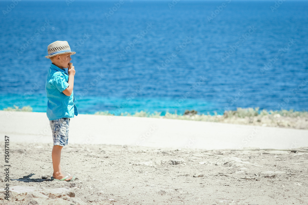 A happy child near the sea in nature on a weekend trip A happy child near the sea in nature on a weekend trip