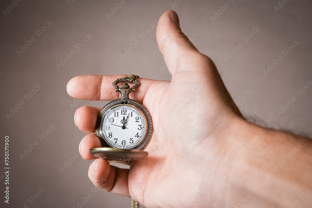 a pocket watch in the hands of a man a pocket watch in the hands of a man