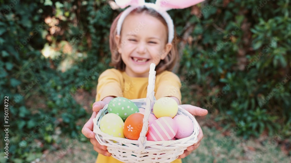 Easter egg hunt. Excited emotion surprise adorable child girl in bunny ears rabbit costume hold basket with Easter colored eggs. Children positive emotions. Kid happy Easter. Egg hunting outside Easter egg hunt. Excited emotion surprise adorable child girl in bunny ears rabbit costume hold basket with Easter colored eggs. Children positive emotions. Kid happy Easter. Egg hunting outside