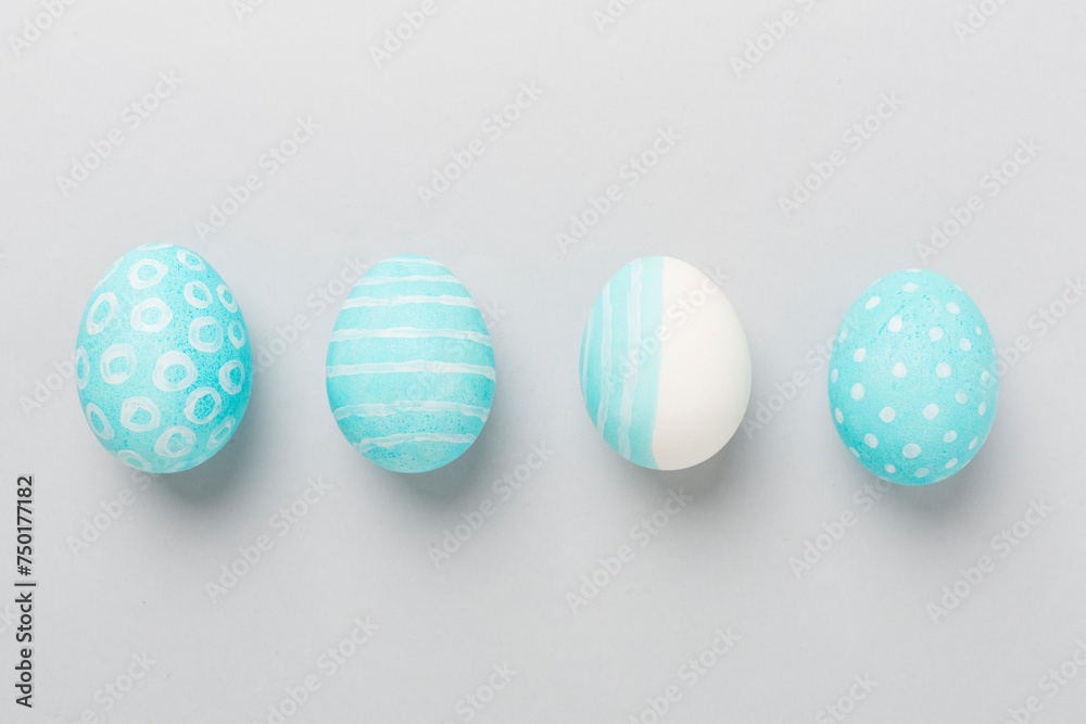Blue easter eggs on color background, top view