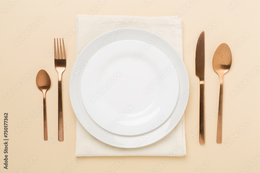 Minimal table setting on color background, top view Minimal table setting on color background, top view