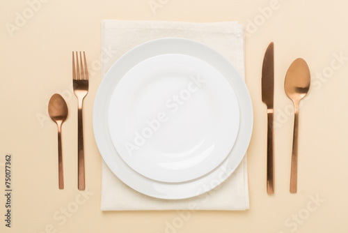 Minimal table setting on color background, top view