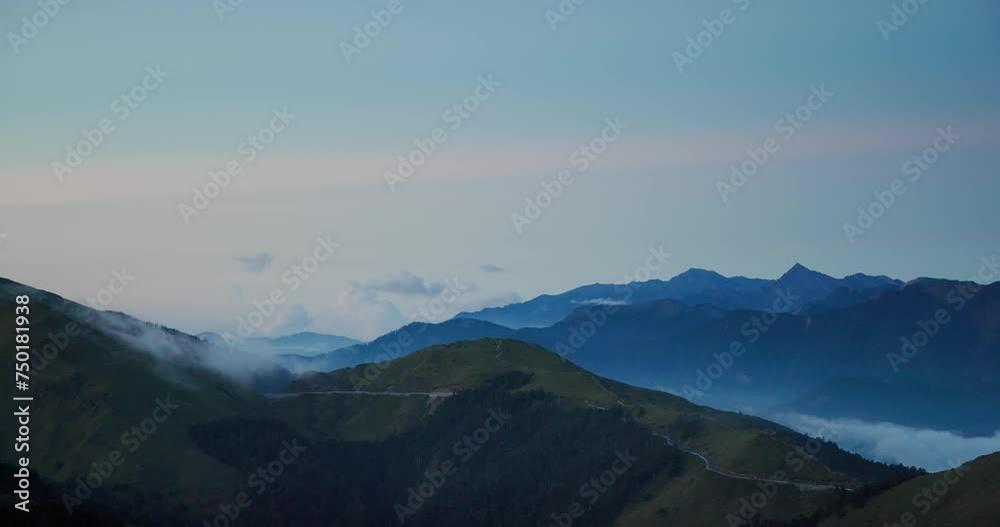 Sea of the cloud over the mountain at sunset time Sea of the cloud over the mountain at sunset time