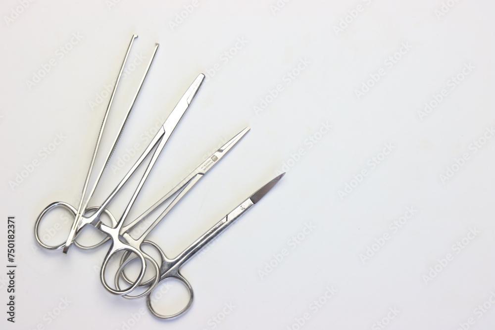 Operating Room Instruments White Background Surgical instruments in the left side of the white background with copy ...