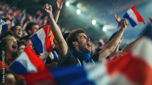 Football fans with flags of France celebrate the victory on the stage. Football concept. Concept of 2024 UEFA European Football Championship