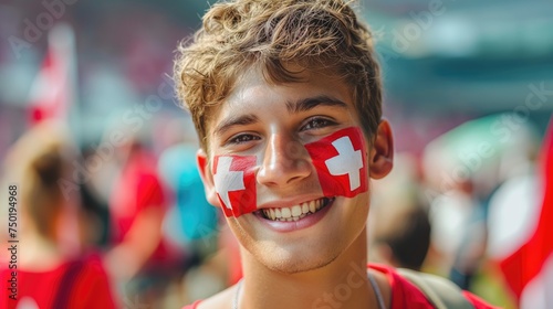 Portrait of football fan with swiss flag on his face. Concept of 2024 UEFA European Football Championship  photo