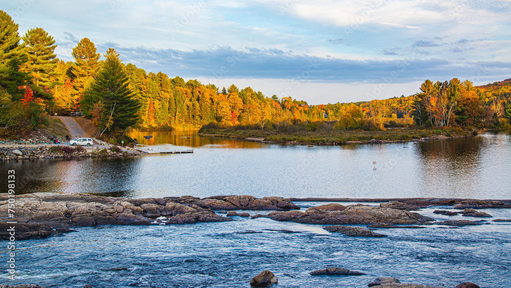 Fototapeta premium Dorwin Chute, Canada: Oct. 25 2021: Colorful autumn scenery view of Dorwin Chute in Quebec