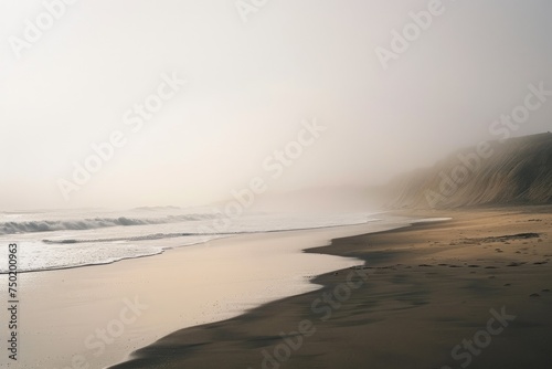 Tranquil beach scene with foggy mist - A peaceful beach and ocean scene enveloped in a soft, foggy mist creates a space for reflection and calm