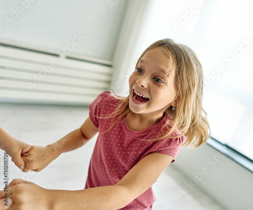 child girl kid love family dancing childhood fun happy joy happiness cute cheerful young hold hand holding hands smiling playing dance music