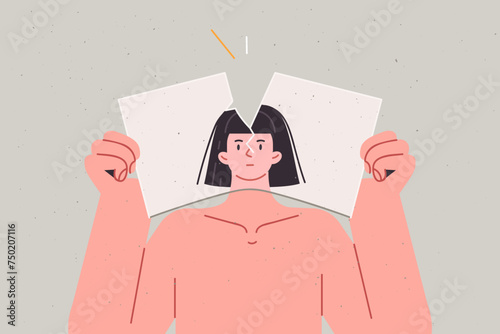 Woman suffers from identity crisis caused by psychological trauma and tears up portrait