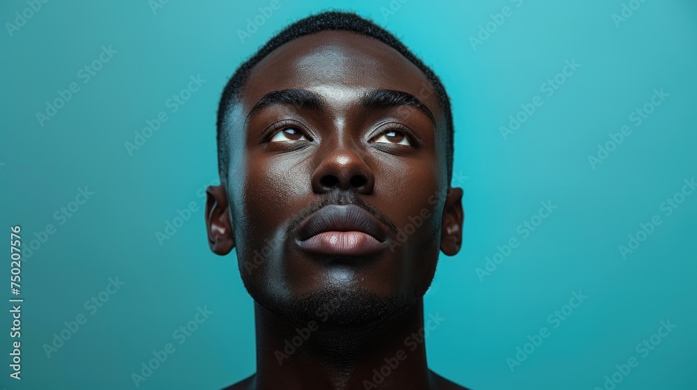 a close up of a man's face with his eyes wide open and his nose to the side, with a blue background behind him is a black man's head. a close up of a man's face with his eyes wide open and his nose to the side, with a blue background behind him is a black man's head.