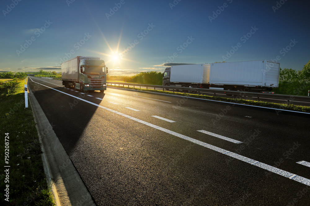 Truck on the road at sunset