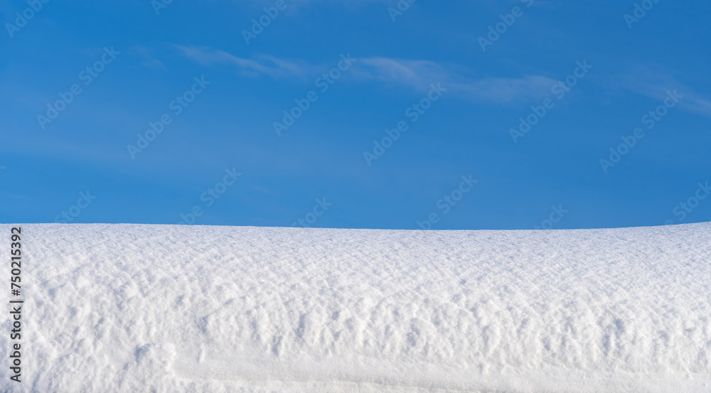 winter landscape, snow-covered field with snowdrifts against the blue sky winter landscape, snow-covered field with snowdrifts against the blue sky