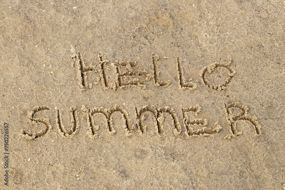 Fototapeta premium Inscription Hello Summer on the sand.Top view, flat lay. Sea vacation travel concept tourism and resorts. Summer holidays.