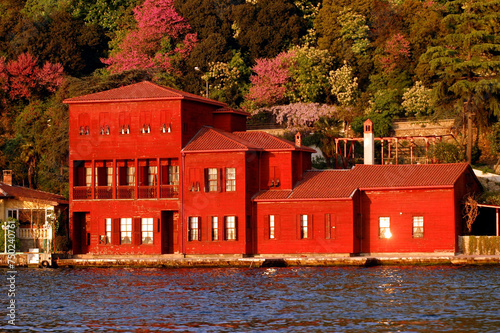 Old red house in autumn, İstanbul, Turkey.  Hekimbasi Salih Efendi Mansion.  photo