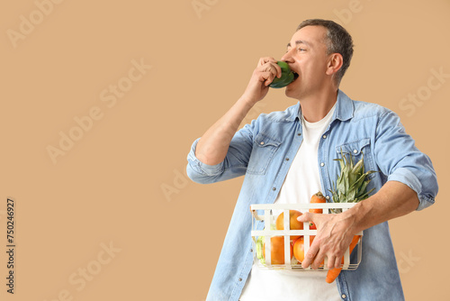 Mature man with basket of f...