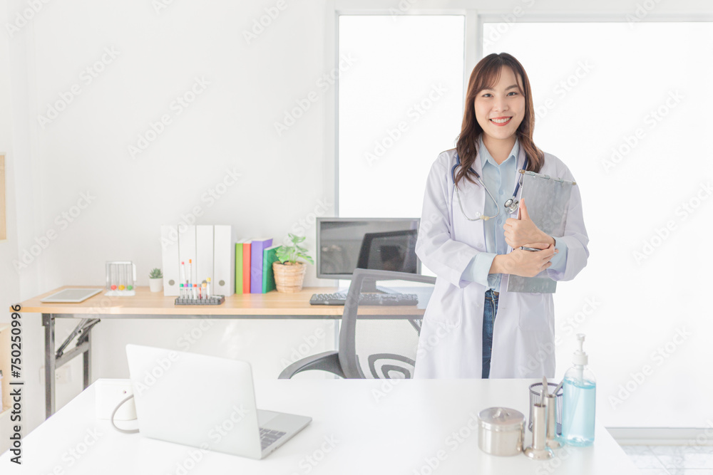 asian female doctor stand and prepare do work in clinic office, she holding patient chart and order medicine in hospital, treatment information asian female doctor stand and prepare do work in clinic office, she holding patient chart and order medicine in hospital, treatment information