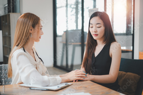 Free Download Employee receives a consultation from a healthcare professional, discussing health matters in a modern office environment. - GFXLoad