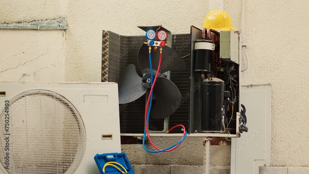 Zoom in shot of damaged external air cooling unit with protection cover