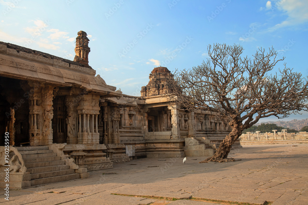 Medieval stone architecture ruins inside Vijaya Vittala temple complex at Hampi, Karnataka, India.
