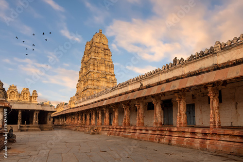 Medieval architecture stone structure with archeological ruins of Virupaksha temple at Hampi, Karnataka, India. 