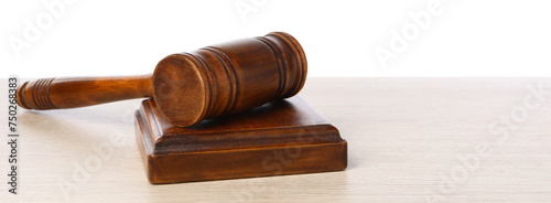 Wooden gavel on light table against white background. Space for text