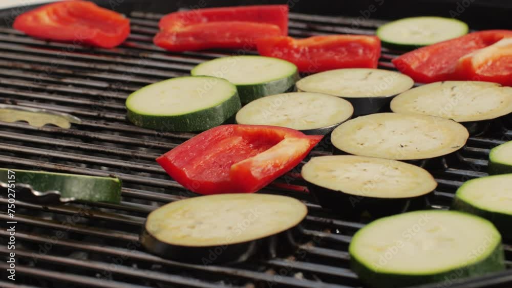 Cooking many various of vegetables on grill close-up. Making garnish for kebab and burgers. Fry corn, red pepper, zucchini and onion. Barbecue for friends and family. Cafe and restaurant Cooking many various of vegetables on grill close-up. Making garnish for kebab and burgers. Fry corn, red pepper, zucchini and onion. Barbecue for friends and family. Cafe and restaurant